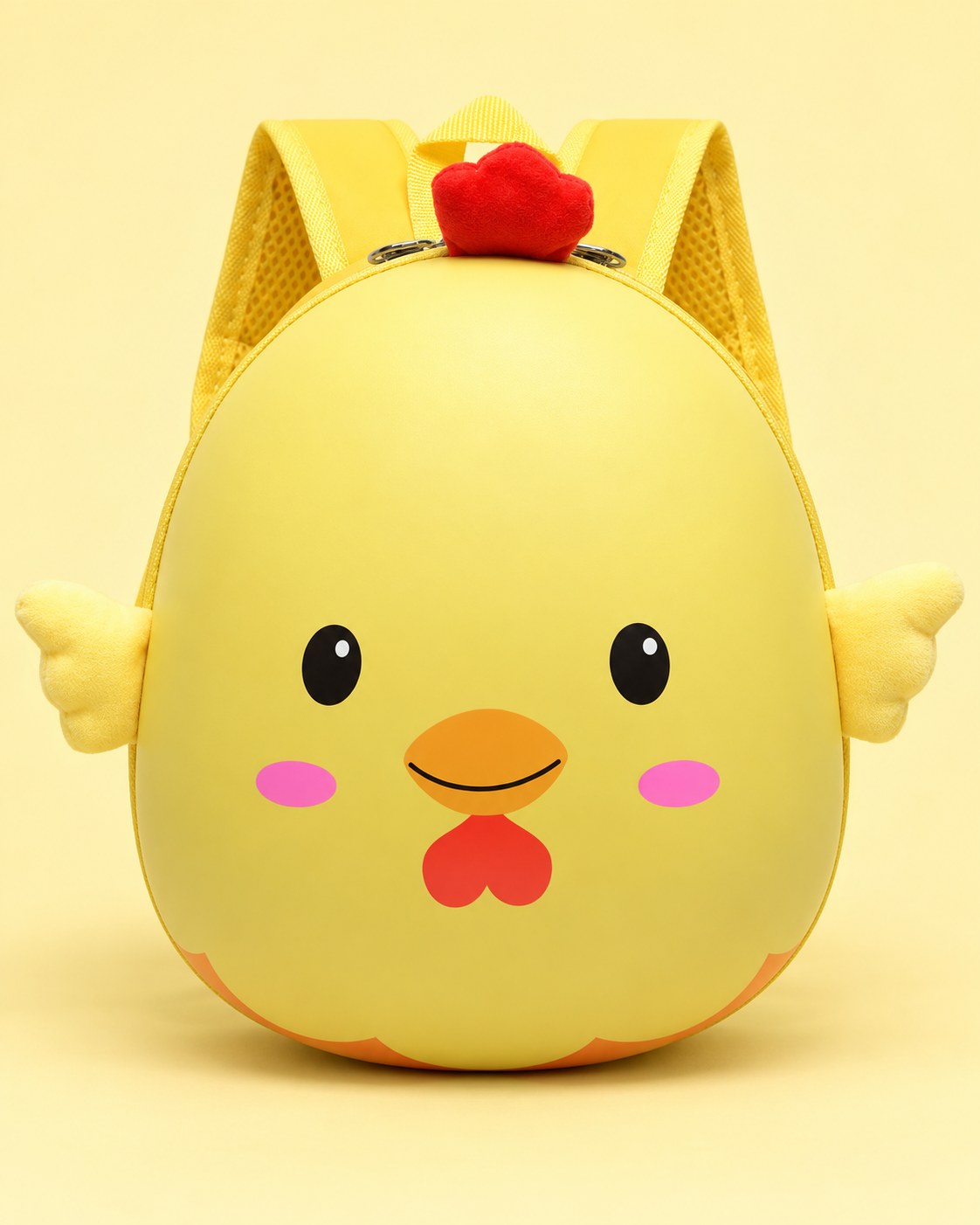 Yellow chick backpack on a pale yellow studio background